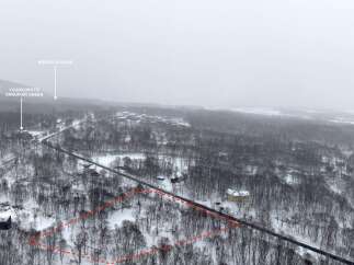 Discover a prime real estate opportunity nestled in a serene, snow-covered landscape.