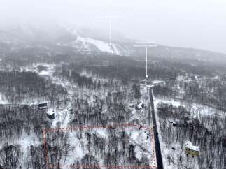 Discover this prime real estate opportunity nestled in a serene, snow-covered landscape.