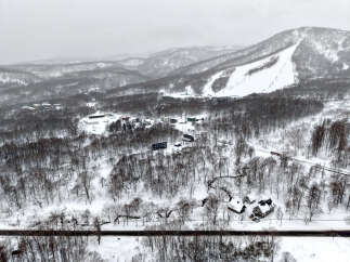 Discover this prime real estate opportunity nestled in a serene, snow-covered landscape.