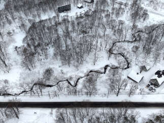 Discover this serene winter wonderland property, perfect for those seeking a peaceful retreat.