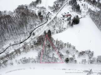 Discover this expansive winter wonderland, perfect for development or recreation.