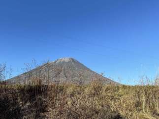 Experience breathtaking natural beauty with this stunning property offering panoramic views of a majestic mountain.