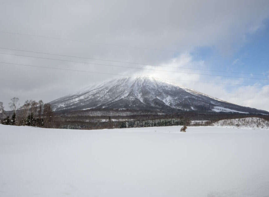 Experience the serene beauty of a winter wonderland with this stunning mountain landscape.