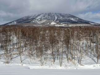 Experience the serene beauty of winter with this stunning mountain view, perfect for a tranquil retreat.