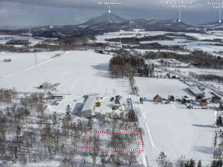 Discover this prime parcel of land nestled amidst a serene winter landscape, offering a unique opportunity for development or personal retreat.