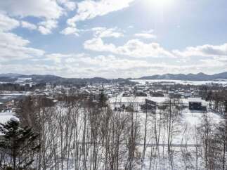 Discover this charming winter village nestled amidst rolling hills and snow-covered landscapes.