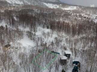 Discover your dream winter escape with this stunning property nestled amidst snow-covered trees.