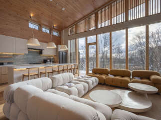 Experience modern living in this stunning open-concept space, featuring a sleek kitchen with a marble backsplash and a large island perfect for entertaining.