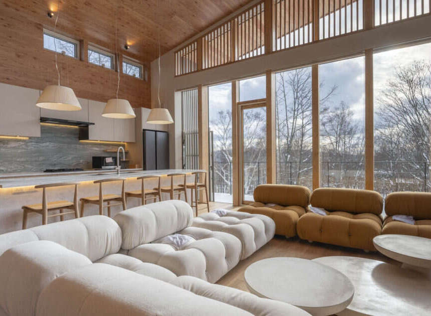 Experience modern luxury in this stunning open-concept living space, featuring a gourmet kitchen with sleek cabinetry and a spacious island perfect for entertaining.