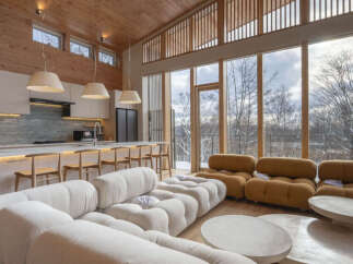 Experience modern luxury in this stunning open-concept living space, featuring a gourmet kitchen with sleek cabinetry and a spacious island perfect for entertaining.