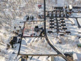 Discover this prime piece of real estate nestled in a serene, snow-covered landscape.