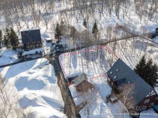 Discover this charming property nestled in a serene, snow-covered landscape, perfect for a winter retreat.
