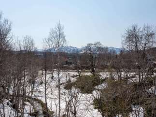 Discover this charming property nestled amidst a serene winter landscape.
