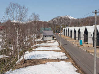 Discover modern living in this new development featuring a row of contemporary homes with distinctive A-frame roofs.
