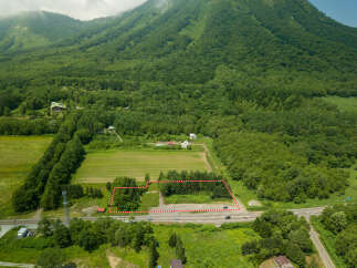 Discover this expansive parcel of land nestled amidst lush greenery and rolling hills, offering a serene escape.