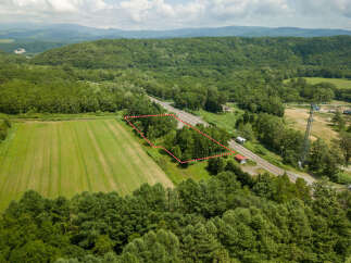 Discover this prime parcel of land nestled amidst lush greenery and rolling hills.