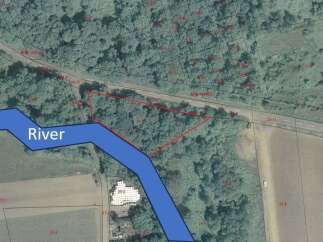 Discover this prime parcel of land, ideally situated adjacent to a serene river, offering a unique blend of natural beauty and accessibility.