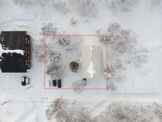Discover this charming property nestled in a serene, snow-covered landscape.