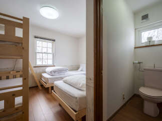 This cozy room features a space-saving bunk bed, perfect for families or groups.