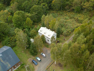 Discover this charming property nestled amidst lush greenery, offering a serene escape.