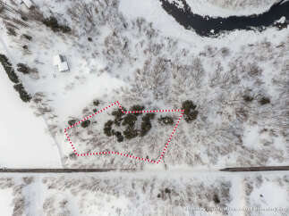 Discover this picturesque property nestled in a serene, snow-covered landscape.