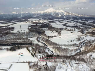 Discover your dream property nestled in a serene, snow-covered landscape with breathtaking mountain views.