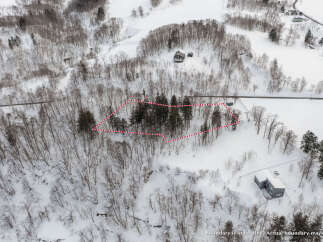 Discover this stunning property nestled in a serene, snow-covered landscape.