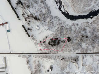 Discover this unique property nestled in a serene, snow-covered landscape.