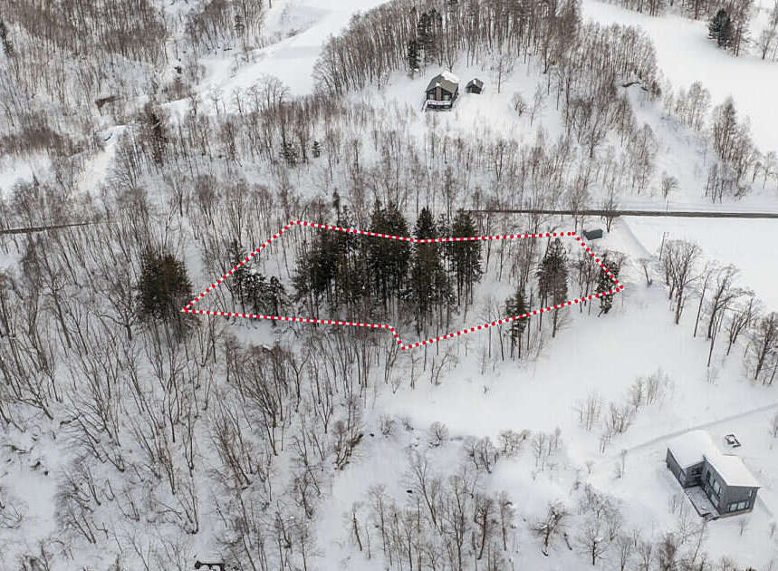 Discover this picturesque property nestled in a serene, snow-covered landscape.