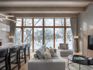 Experience luxury living in this stunning modern home, featuring a spacious open-concept living and dining area with a sleek kitchen island perfect for entertaining.