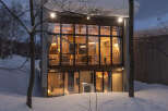 Experience modern living in this stunning architectural home nestled in a serene, snowy landscape.