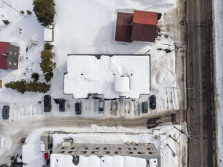 Discover this charming property nestled in a serene, snow-covered landscape.