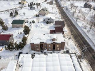 Discover this charming property nestled in a serene, snow-covered landscape.
