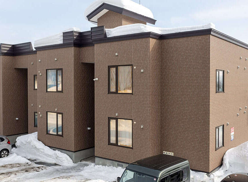 Discover modern living in this multi-story brick building, perfect for a snowy climate.