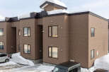 Discover modern living in this multi-story brick building, perfect for a snowy climate.