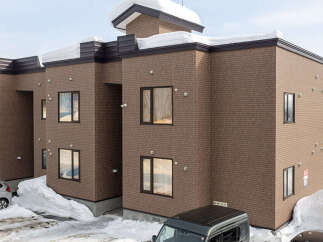 Discover modern living in this multi-story brick building, perfect for a snowy climate.