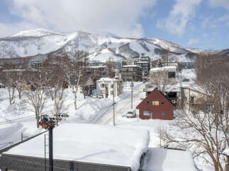 Experience the charm of a winter wonderland with this picturesque property nestled in a snowy mountain village.