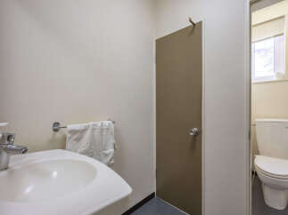 This bathroom features a clean and functional design, perfect for any home.
