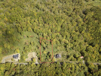 Discover this stunning property nestled amidst vibrant autumn foliage, offering a serene escape.