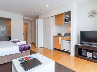 Discover modern studio living with a convenient kitchenette and a private bathroom, perfect for a comfortable stay.