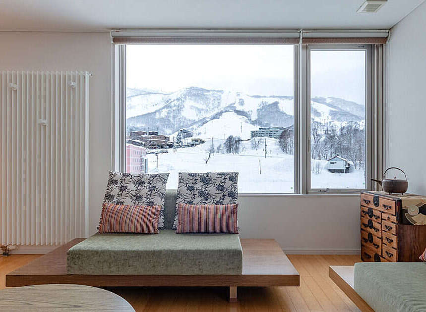 Experience breathtaking mountain views from this modern living room, perfect for a cozy retreat.