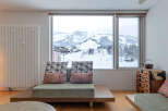 Experience breathtaking mountain views from this modern living room, perfect for a cozy retreat.