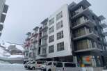 Discover modern living in this stunning apartment complex, featuring spacious balconies with breathtaking mountain views.