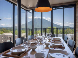 Experience breathtaking mountain views from this elegant dining room, perfect for hosting memorable meals.