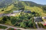 Discover this prime parcel of land nestled amidst lush greenery, offering a serene escape with mountain views.