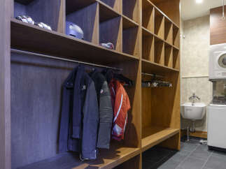 Discover a well-organized storage and laundry area, perfect for keeping your ski gear and apparel tidy.