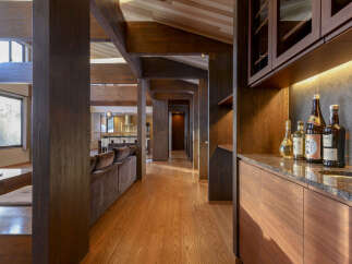 Experience luxurious living in this stunning home featuring exposed wooden beams and a spacious open-concept layout.