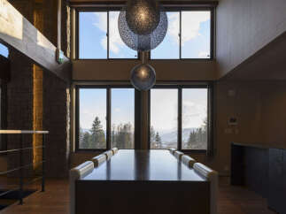 Experience breathtaking mountain views from this stunning property, featuring expansive windows that flood the space with natural light.