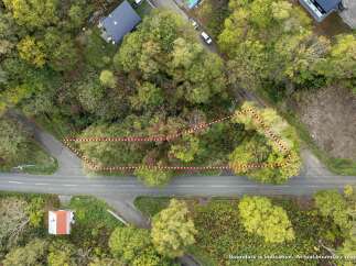 Discover this prime parcel of land, nestled amidst lush greenery and mature trees, offering a serene and private setting.