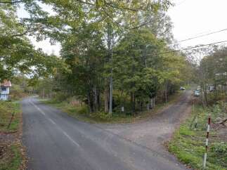 Discover this charming property nestled amidst a serene, tree-lined landscape, offering a peaceful retreat.